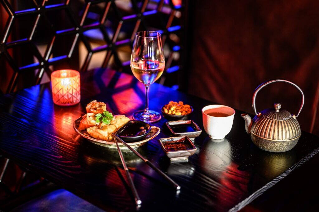 Dishes and tea under blue light