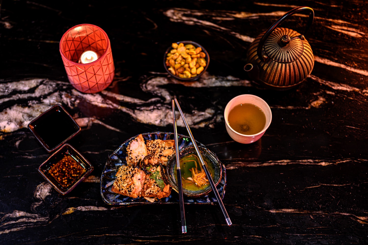 Zodiac dishes on a black marble table